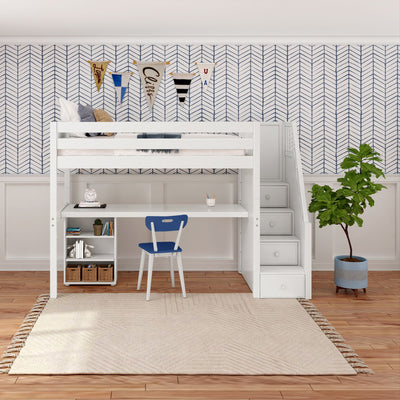 Loft bed with integrated desk and storage steps in a stylish children's room featuring chevron wallpaper and a cozy blue chair.