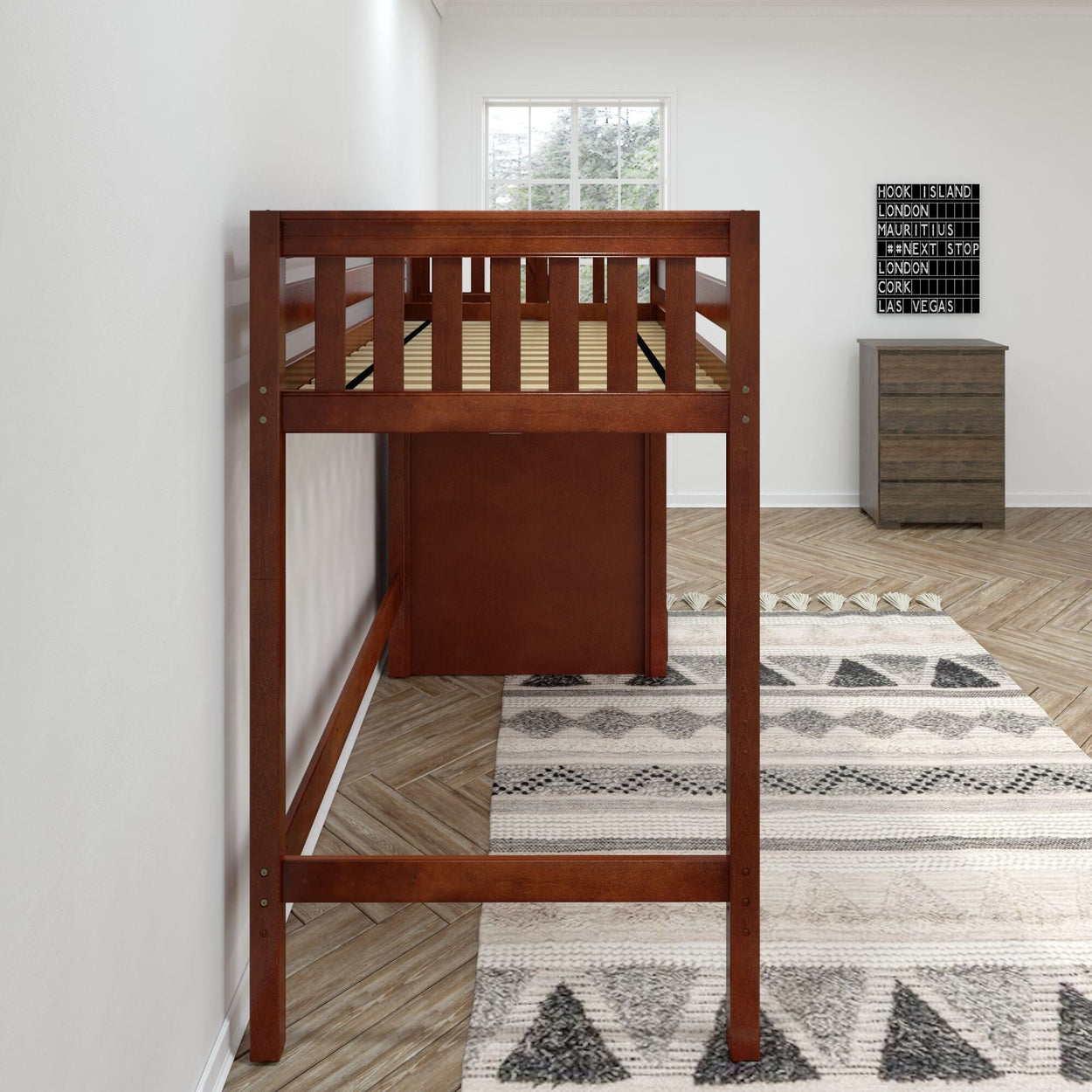 Wooden loft bed in modern bedroom with patterned rug and natural light.