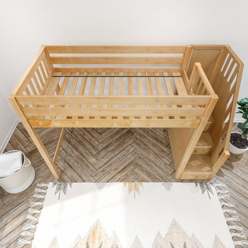 Top-down view of a natural wood loft bed for kids with ladder and slatted guardrails in a modern nursery featuring herringbone hardwood floors, a boho fringe rug, and a potted plant