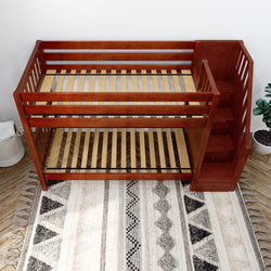Wooden bunk bed with built-in storage stairs in modern bedroom setting.