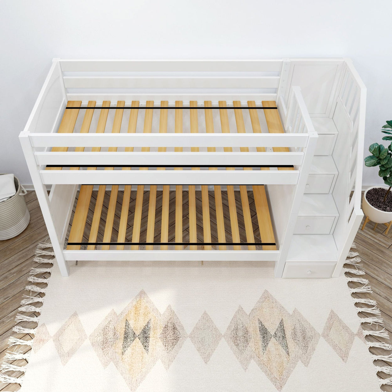 White wooden bunk bed with built-in staircase, shown in a modern bedroom.