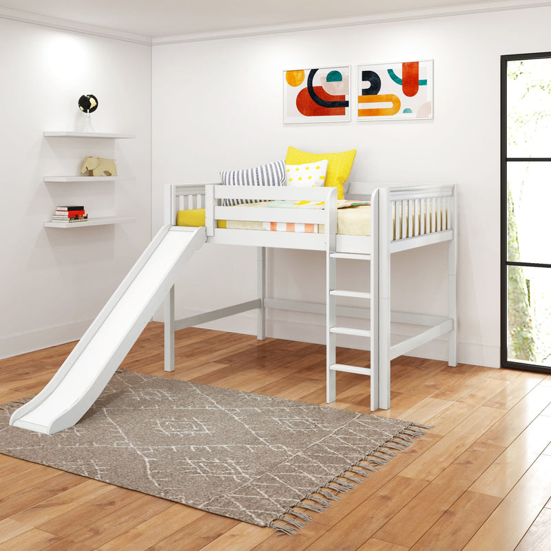 White wooden kids loft bed with slide in modern nursery, yellow and striped pillows, abstract wall art, hardwood floors and a patterned play rug