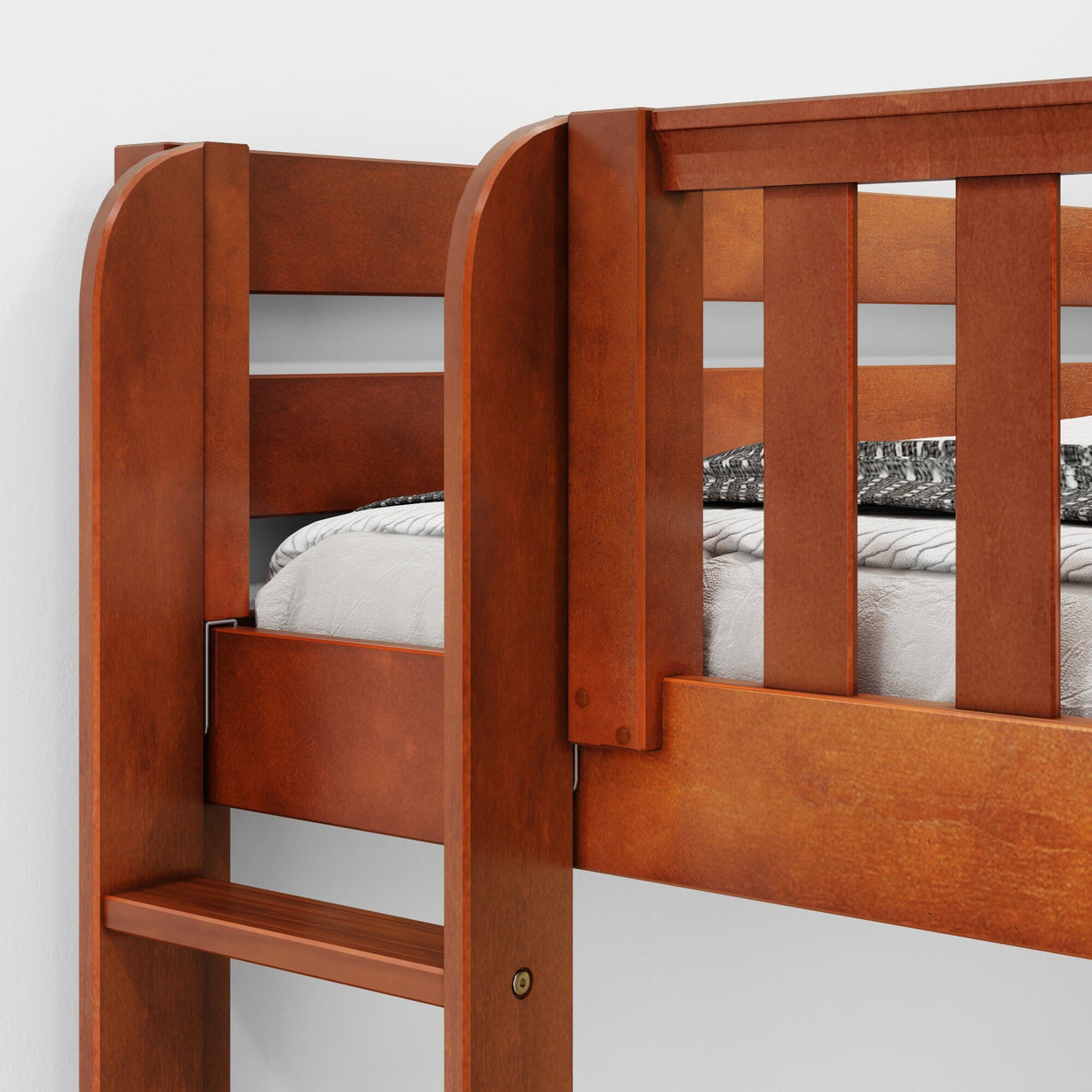 Wooden bunk bed with ladder, featuring a cozy mattress and printed blanket, ideal for maximizing space in small bedrooms.