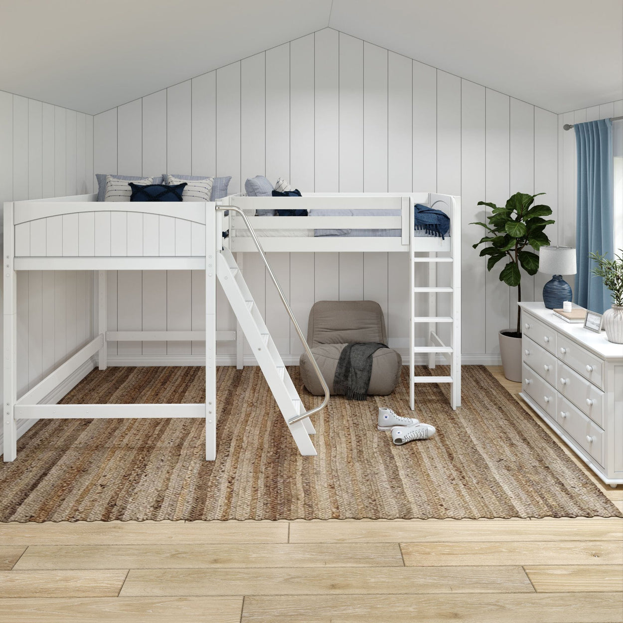 White loft bed in a modern bedroom with a cozy chair, green plant, and natural rug flooring.