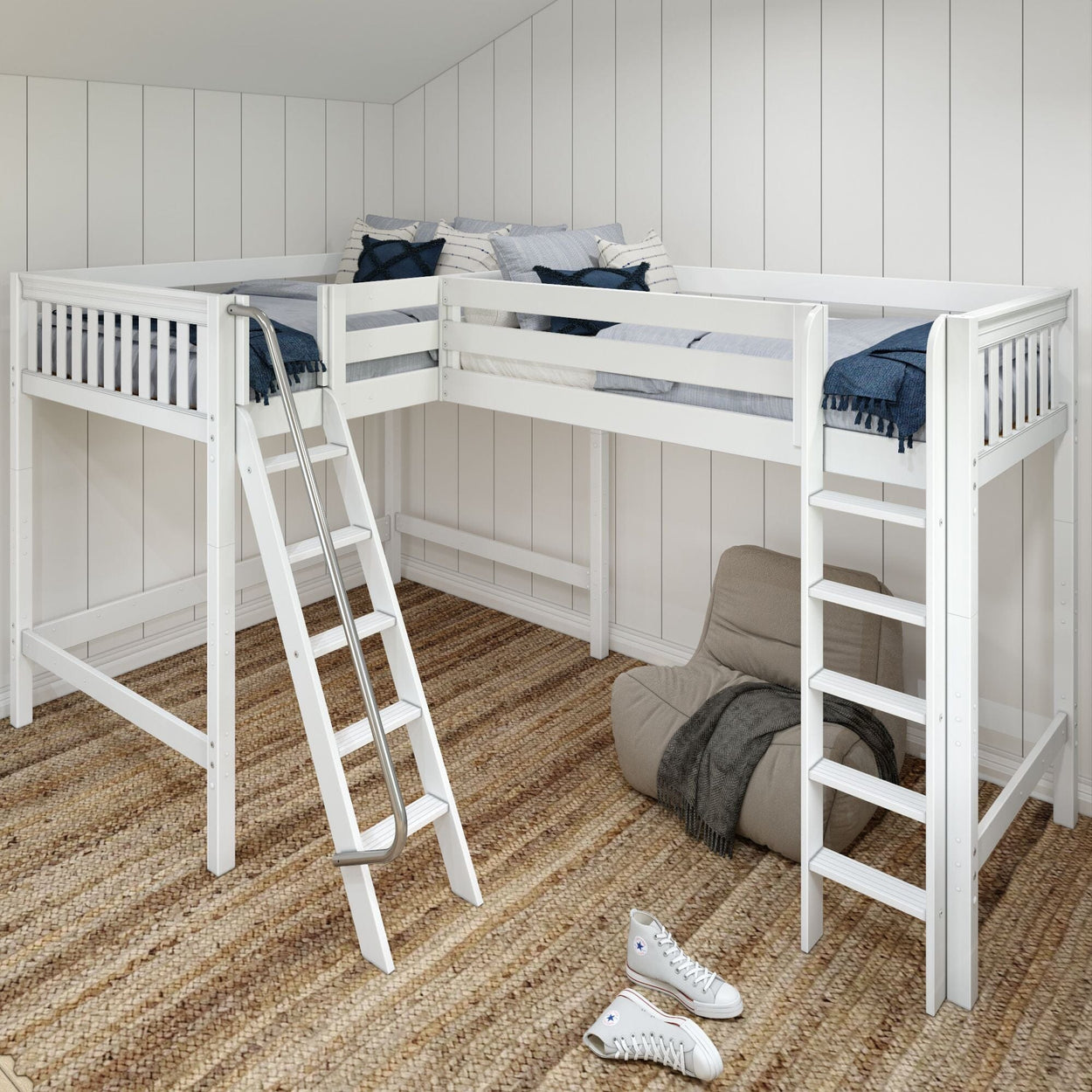 White wooden loft bed with ladder and cozy blue bedding in a modern bedroom setup with a woven rug and casual sneakers.