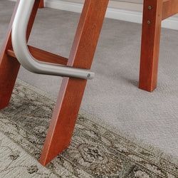 Red wooden ladder close-up on a carpeted floor with a textured rug.