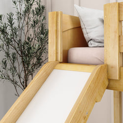 Wooden indoor slide for kids with cushion and plant in modern room decor.