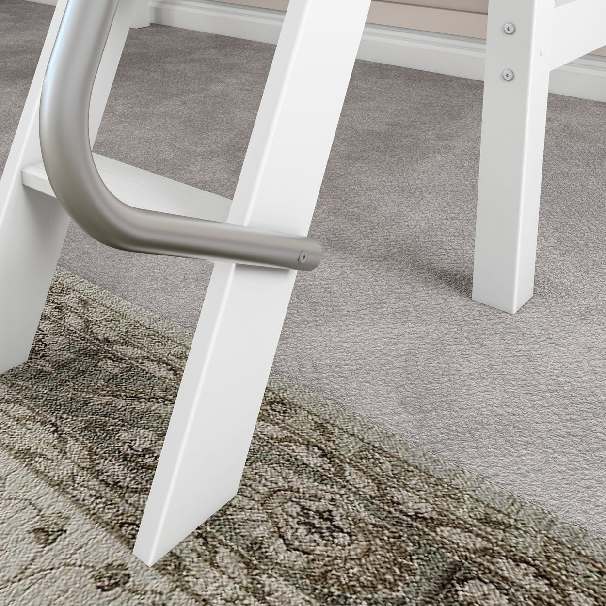 Close-up of modern white ladder with metal handle on carpeted floor and patterned rug.