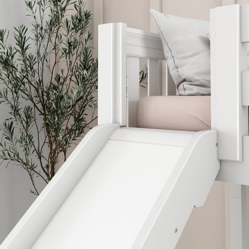 White wooden children's bunk bed slide with soft pink mattress, textured gray pillow and botanical wallpaper in modern nursery