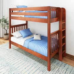 Wooden bunk bed with blue bedding in a bright bedroom setting.