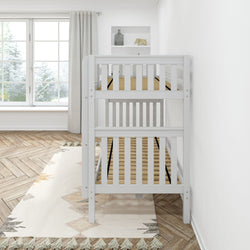 White wooden baby crib in a bright nursery room with herringbone wood floors and a large window.