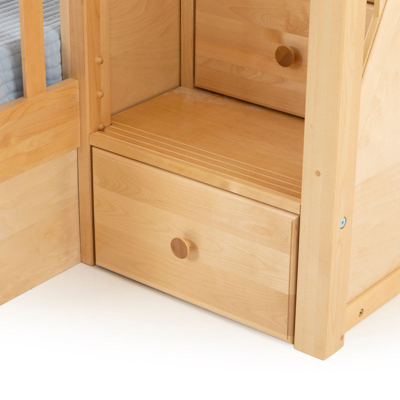 Close-up of a light maple wooden bunk bed with built-in under-bed storage drawers and round wooden knobs, natural finish bedroom furniture