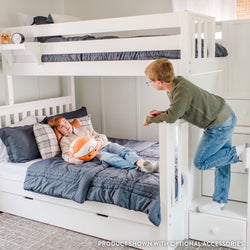 Kids playing on a white bunk bed in a cozy bedroom setting with a plush toy.