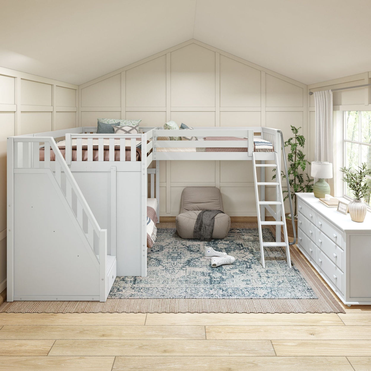 Cozy bedroom with loft bed, white dresser, and soft armchair, featuring plants and natural light.