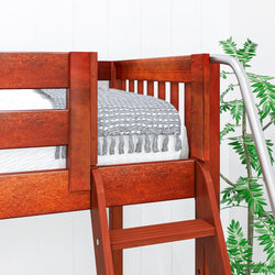 Wooden bunk bed with a gray and white blanket and a silver ladder, next to a green potted plant.