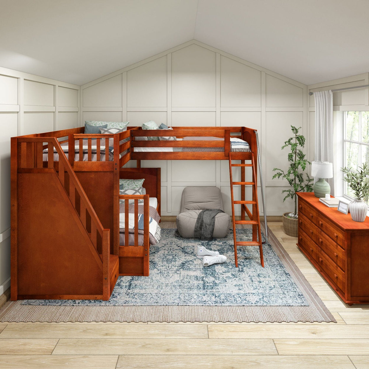 Wooden L-shaped bunk bed in a bright, spacious attic bedroom with cozy decor and large window.