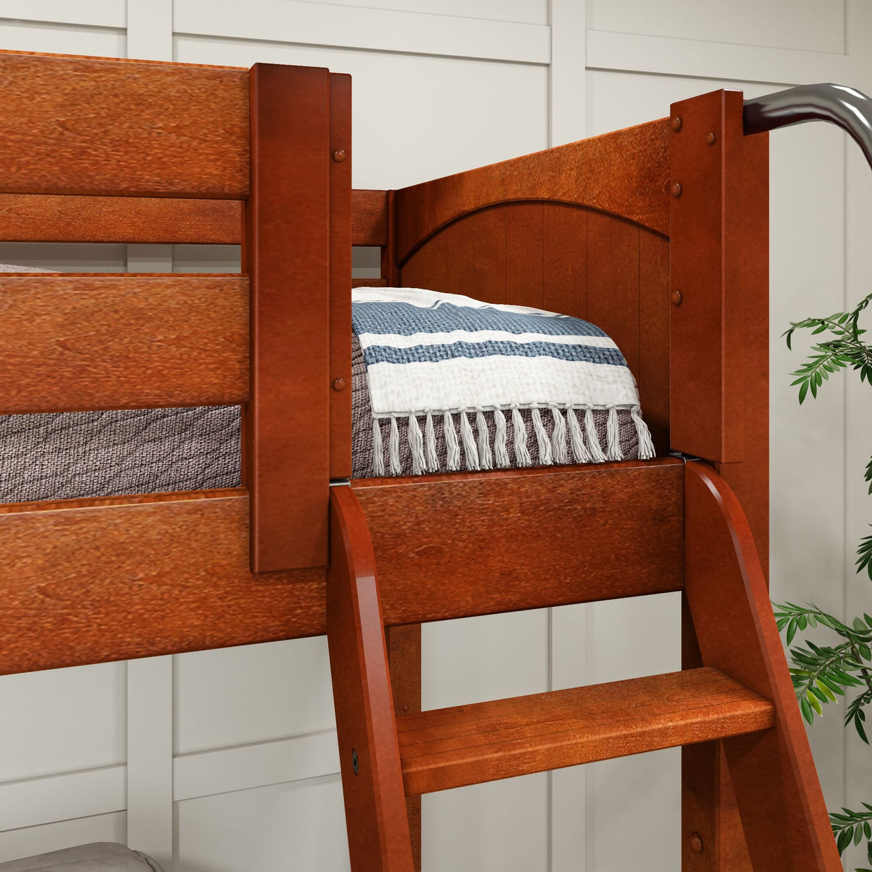 Wooden loft bed with a ladder and cozy bedding in a modern bedroom setting.