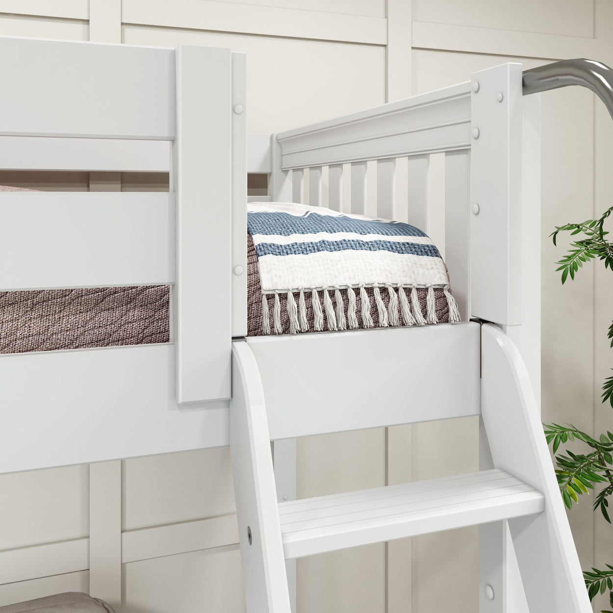 White wooden bunk bed with a colorful striped blanket, featuring a ladder for easy access, ideal for modern bedroom decor.