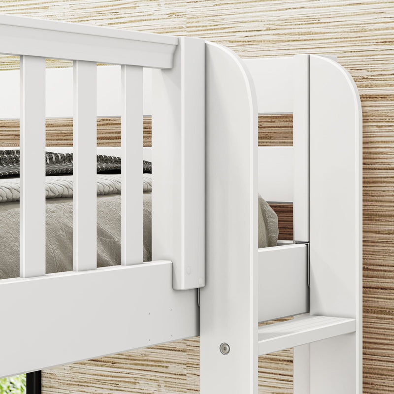 Close-up of white wooden loft bunk bed safety rail and ladder with gray bedding against textured wood-paneled wall
