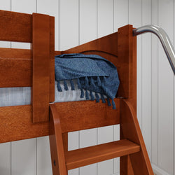Wooden bunk bed with blue blanket and white paneled wall backdrop.