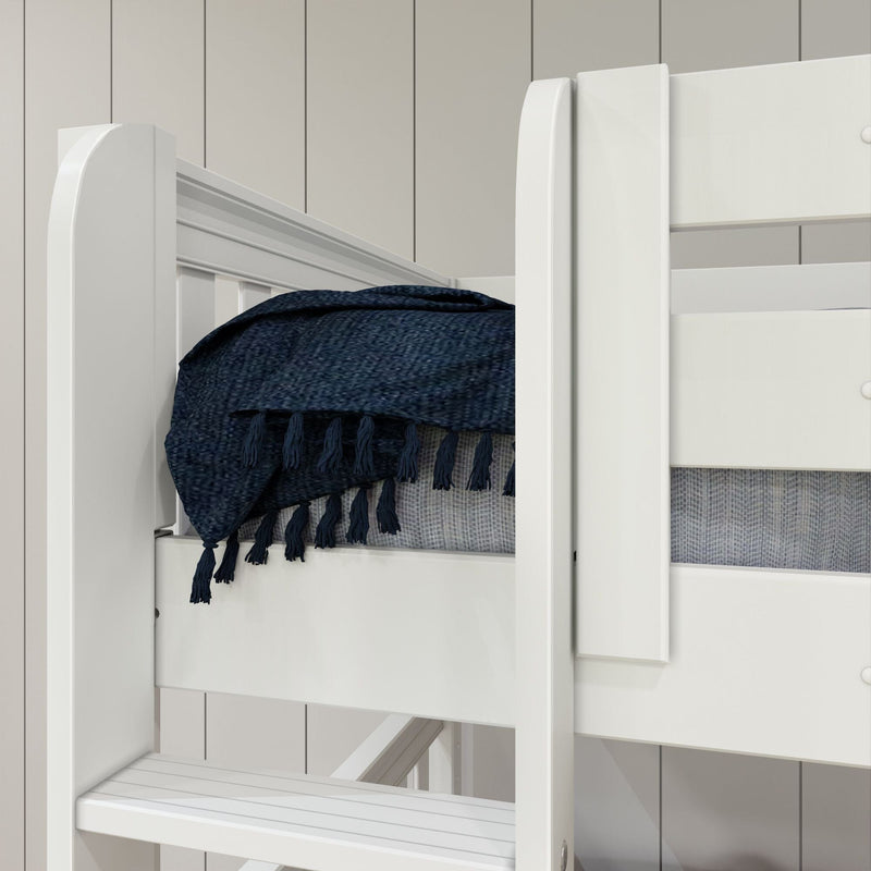 White wooden bunk bed close-up with navy blue tasseled throw and gray mattress against light shiplap wall in a modern kids' bedroom