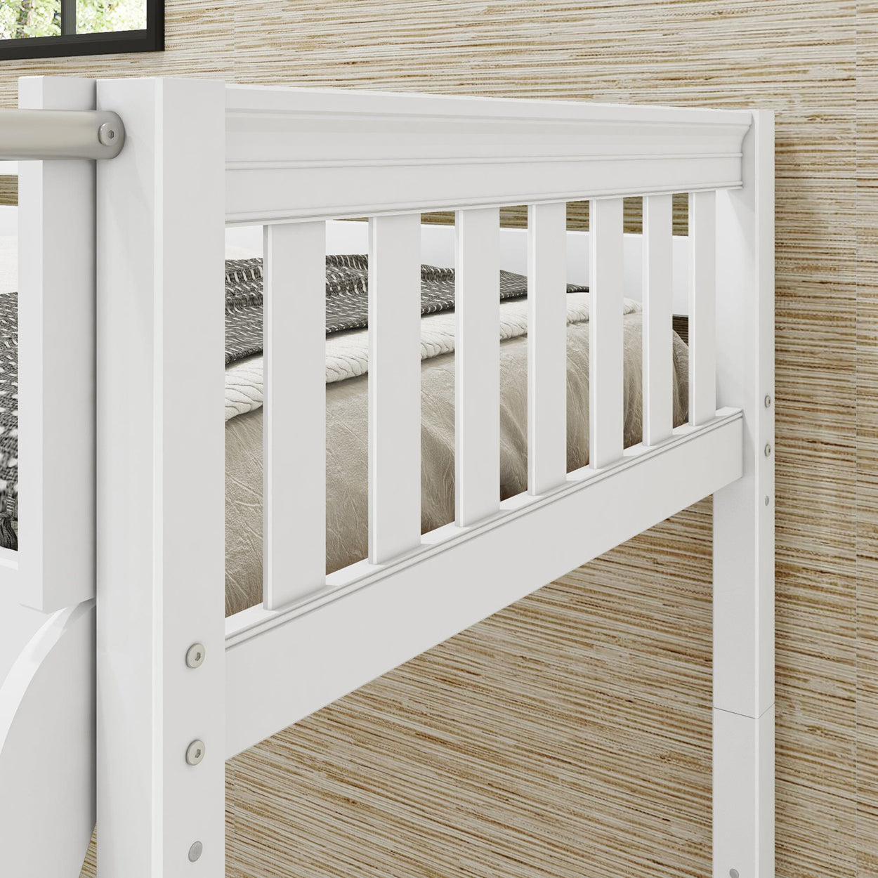 White wooden bunk bed with a safety railing in a cozy bedroom setting.