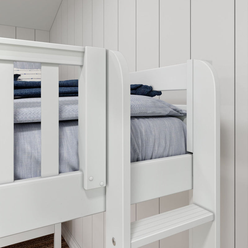 White wooden bunk bed with built-in ladder, gray and navy bedding in a cozy kids' bedroom with white paneled wall