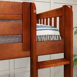 Wooden bunk bed frame with brown finish and striped bedding in modern bedroom.