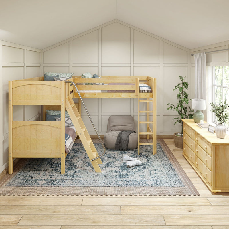 Cozy children's bedroom with natural wood twin-over-twin bunk bed, angled ladder and metal handrail, patterned area rug, wooden dresser and plants in a bright modern farmhouse style.