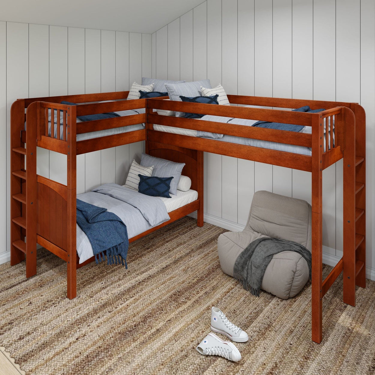 L-shaped wooden bunk bed with cozy white and blue bedding in a modern bedroom setup featuring a comfy chair and woven rug.