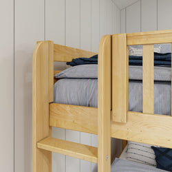 Wooden bunk bed with blue bedding in a modern bedroom setting.