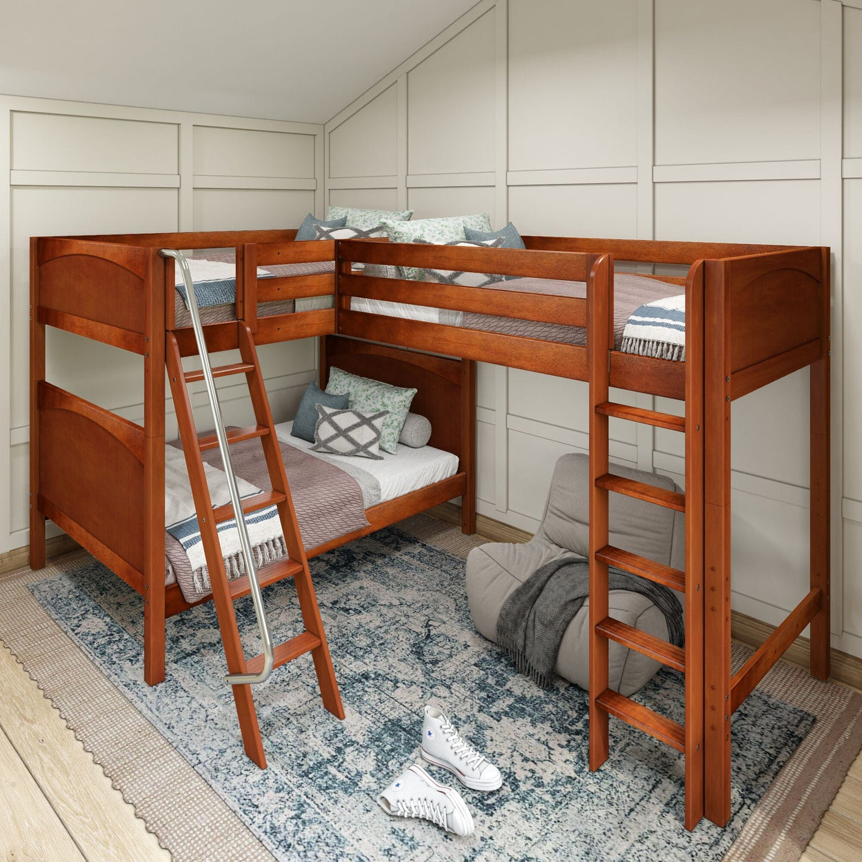 L-shaped wooden bunk bed with ladder in a modern bedroom featuring a patterned rug and gray bean bag chair.