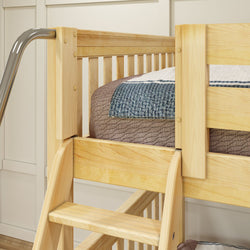 Wooden bunk bed with a cozy bedding setup and ladder in a modern bedroom environment.