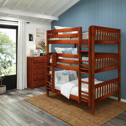 Wooden triple bunk bed in a modern bedroom with blue walls and natural light.
