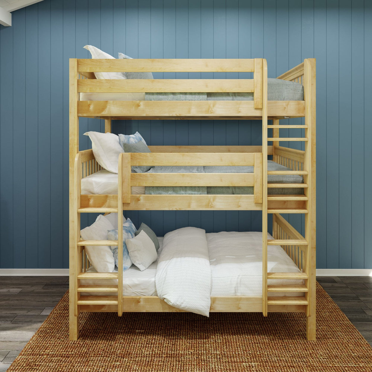 Triple bunk bed in a cozy bedroom with blue paneled walls and a woven rug.