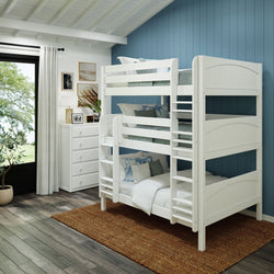 White triple bunk bed in modern bedroom with blue accent wall, natural light, and stylish decor.