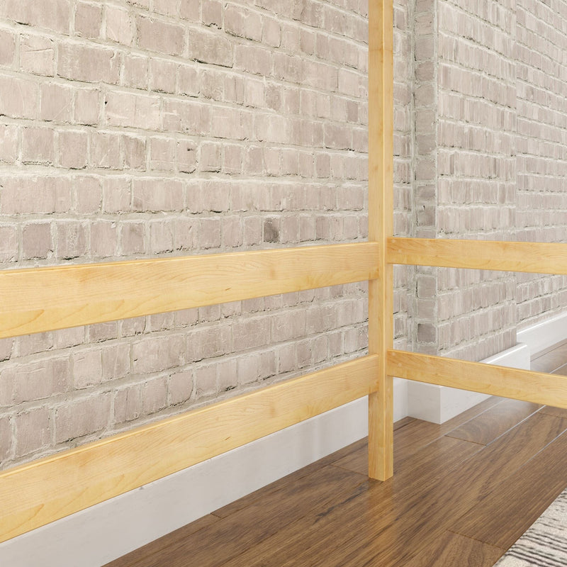 Whitewashed exposed brick interior wall with light wood railing and hardwood floor, modern industrial home detail