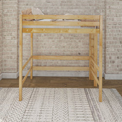 Wooden loft bed frame in modern bedroom with brick wall and geometric rug.