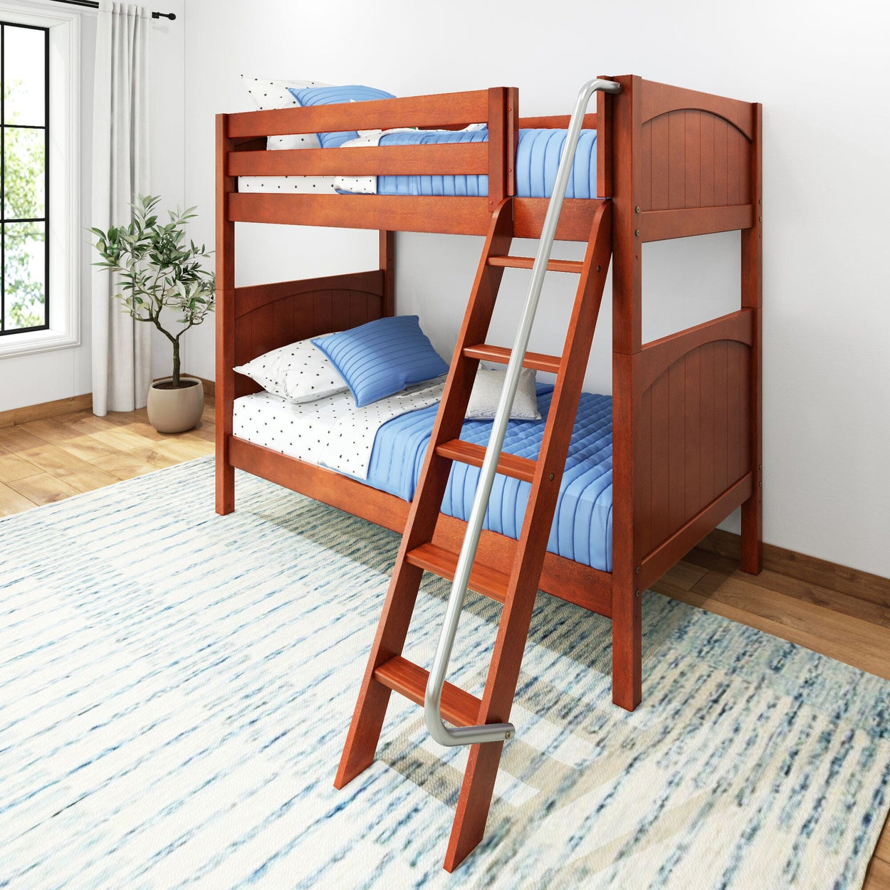 Wooden bunk bed with blue bedding and ladder in a bright children's bedroom.