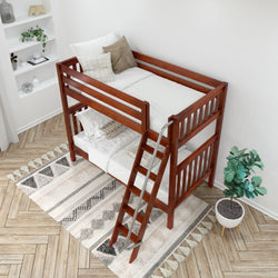 Children's wooden bunk bed with ladder in a cozy bedroom with decorative pillows and a potted plant.