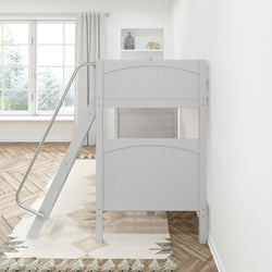 White wooden bunk bed with ladder in a bright, modern bedroom with a large window.