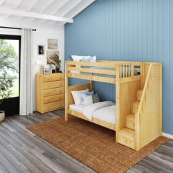 Wooden bunk bed with built-in stairs in a modern children's bedroom with blue accent wall and hardwood flooring.