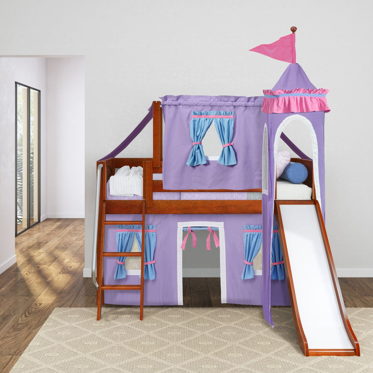 Kids wooden castle loft bed with purple and pink curtains, slide, and ladder in a bright bedroom.