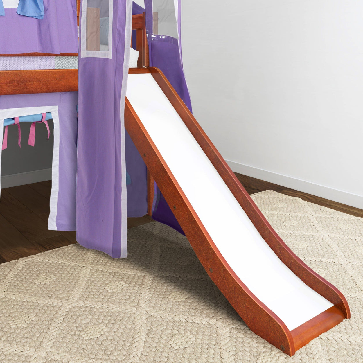 Wooden loft bed with slide and purple curtains for kids' room.