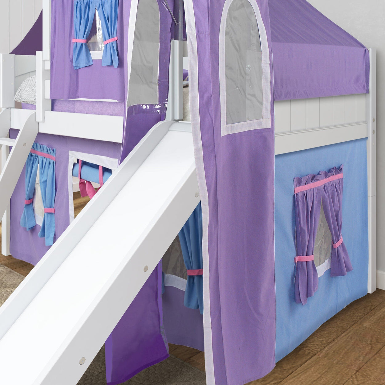 Children's loft bed with purple playhouse tent and white slide.