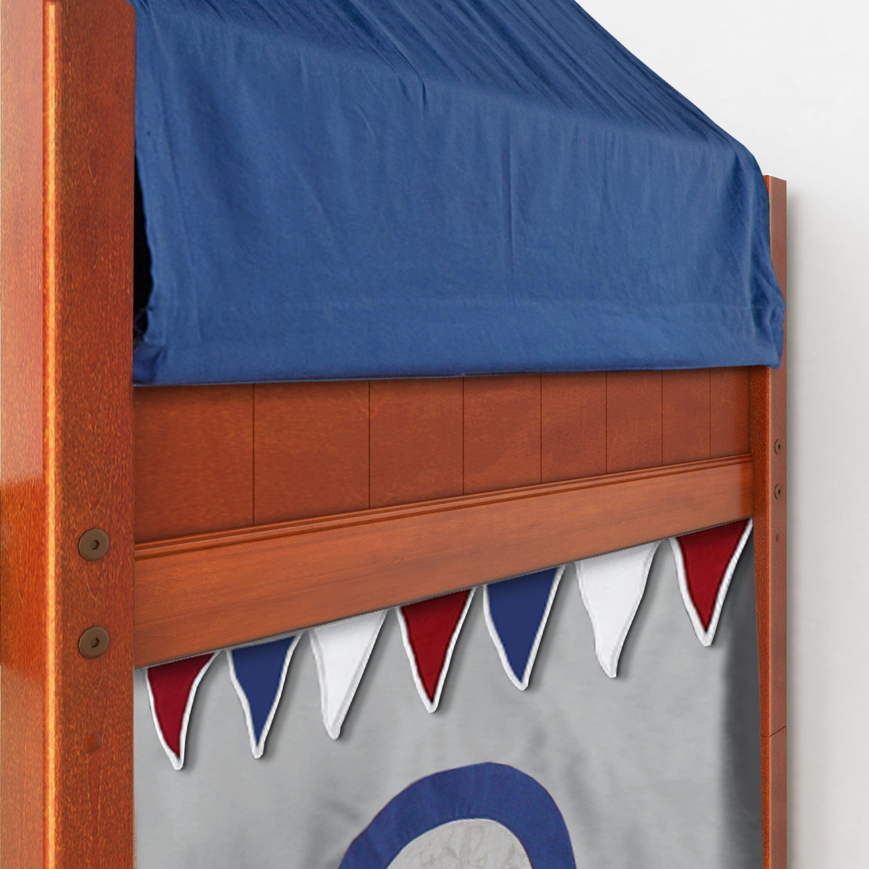 Wooden loft bed with blue and red tent and decorative banners.
