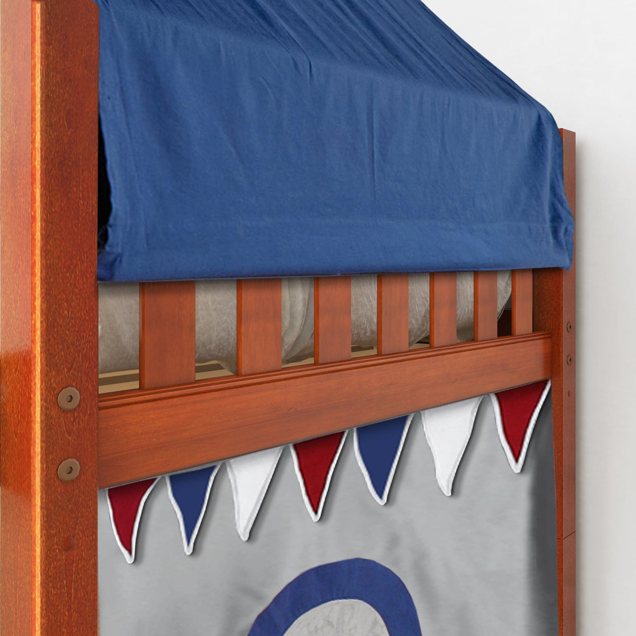 Wooden bunk bed with blue canopy and decorative red, white, and blue pennants.