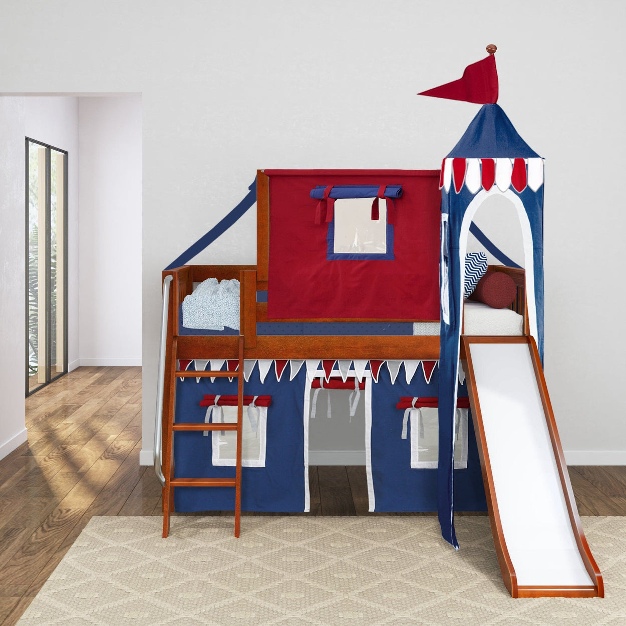 Colorful children's castle-themed loft bed with slide and ladder in a bright room with wooden flooring.