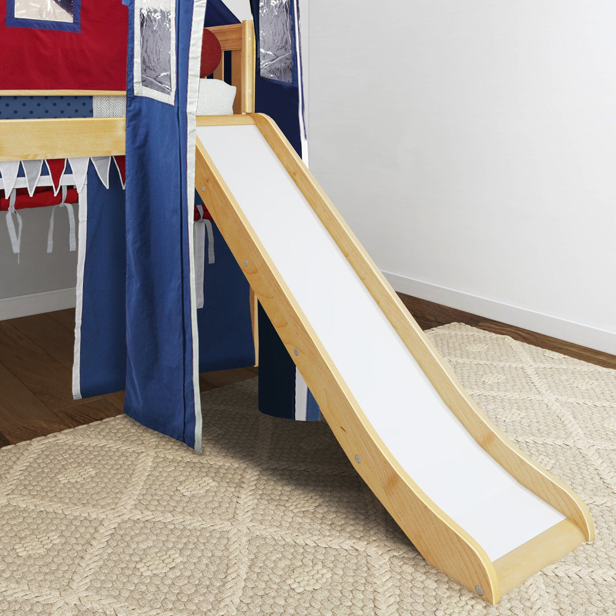 Children's loft bed with slide and vibrant play tent curtains in a cozy indoor setting.