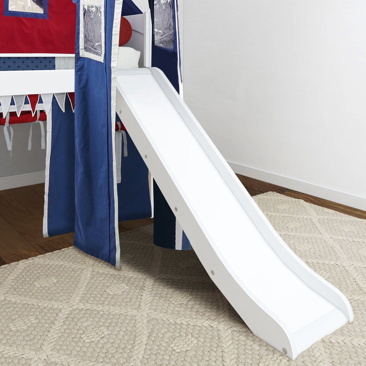Child's bed with play slide and blue-red tent for fun bedroom design.